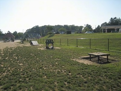 Agility Obstacle Equipment that is setup in a field.