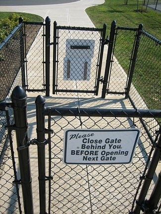 The gates that at the entrance of a Dog Park.