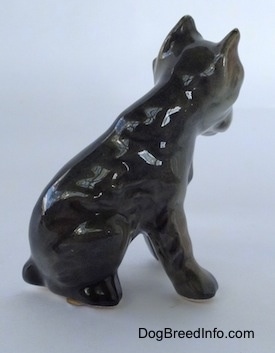 The right side of a grey with black and tan Cane Corso Italiano puppy figurine. The figurine has no paw details.