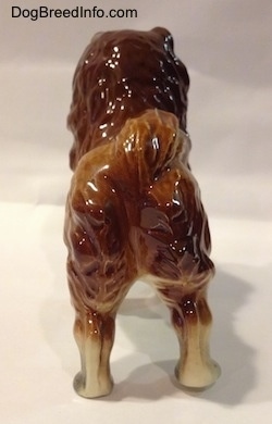 The back of a porcelain Chow Chow figurine. The figurine is glossy.