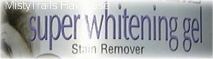 Close up - The label of a bottle that reads - super whitening gel Stain Remover.