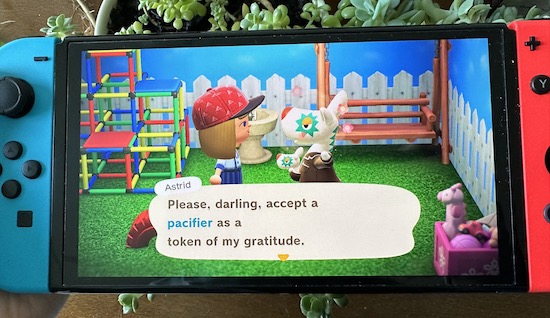 Aries accepting a gift from a fellow villager after healing her illness