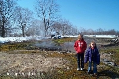A steaming field in Centralia with Amie and Sarah standing in front of the steaming area