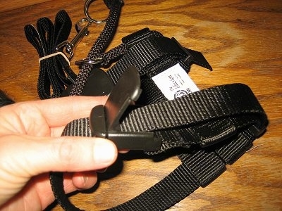 Close up - An Illusion Dog Training Collar that is being picked up by a persons hand