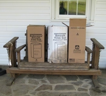 Wooden porch glider with three boxes on top of it