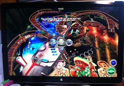 A pinball game on a large computer screen.