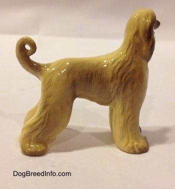 The right side of a tan with black Retired Hagen-Renaker Afghan Hound with wide legs.