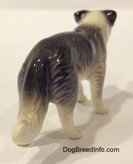 The back right side of a Retired Hagen-Renaker black with white Border Collie style 1 figurine.