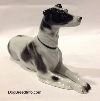 The front right side of a white with black vintage TMK-1 crown mark Borzoi. The figurine has fine hair details.