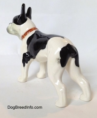 The back left side of a black and white Vintage 1970s TMK 5 Boston Terrier figurine. 