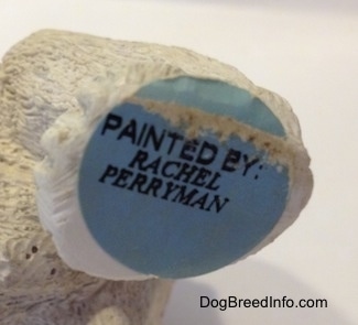 A sticker on the underside of a ceramic mold of a Bulldog figurine. The sticker reads - PAINTED BY: RACHEL PERRYMAN.