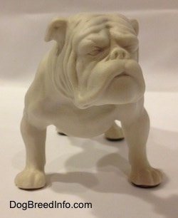A white bisque porcelain Bulldog figurine.