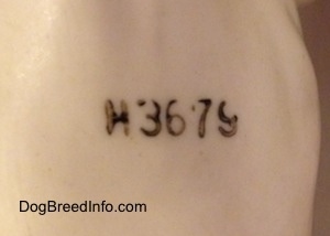 Close up - On the underside of a porcelain Bulldog figurine is the engraved letter/number combination - H3679.