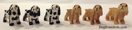 The front right side of six color variations of a Cocker Spaniel figurine. They have basic eyes.