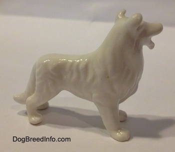 The right side of a bone china figurine that is of a white Rough Collie dog. The figurine has hair shapings.