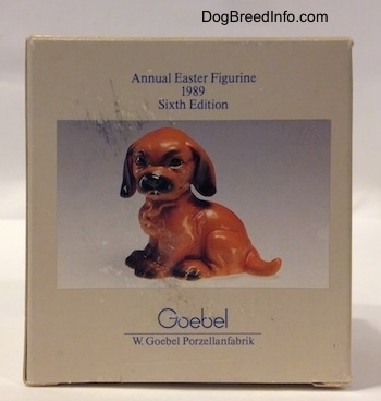 A box with a photo of a Dachshund puppy figurine on it. Above the photo are the words - Annual Easter Figurine, 1989, Sixth Edition - and at the bottom of the image it reads - Goebel W.Goebel Porzellanfabrik.