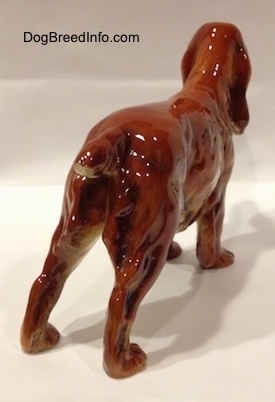 The back right side of a Red English Cocker Spaniel figurine. The figurine has fine hair details.