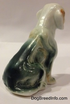 The back right side of a bone chine English Setter figurine. The figurine is glossy.