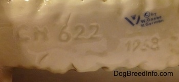 The underside of a porcelain English Setter figurine. It has an engraved letter/number combination - CH 622 - and the number - 1968 - is engraved also. Above it is the stamp of Goebel W.Germany.