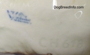 Close up - The underside of a German Shepherd figurine. The figurine has the stamp of Goebel W.Germany stamped on it.