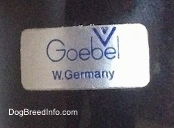 Close up - The underside of a black Labrador Retriever figurine that has a Goebel W. Germany sticker on it.