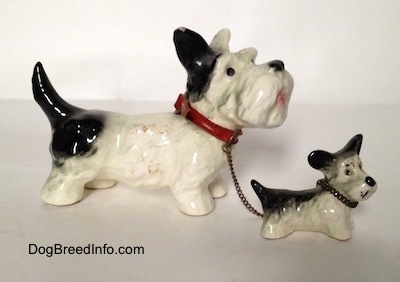 Vintage Goebel figurine set of an adult Miniature Schnauzer chained to its puppy