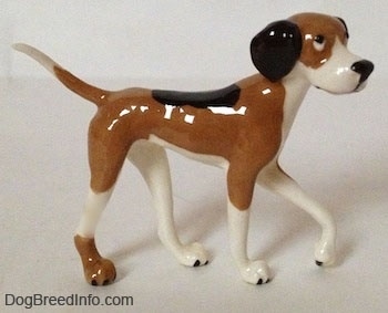 The right side of a tri-color Papa Dog figurine. The figurine has cartoon-y features.