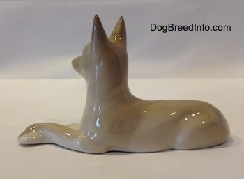 The left side of a Pharoah Hound figurine. The figurine has its ears perked up in the air.