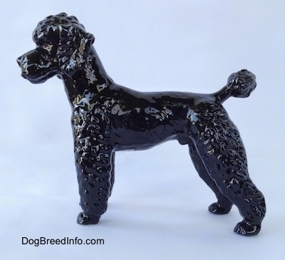 A black Poodle figurine.