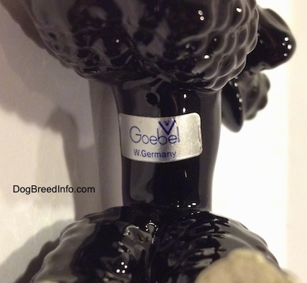 Close up - A sticker of Goebel W.Germany at the bottom of a black Poodle figurine.