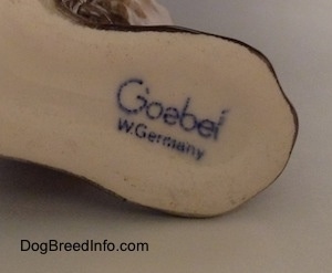 Close up - The underside of a Schnauzer figurine that has the stamp of Goebel W.Germany on it.