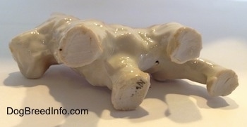 The underside of a bone china Scottish Terrier figurine. The figurine has the black stamp of Japan on its front right leg.