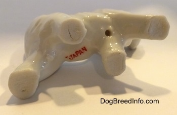 The underside of a bone china Scottish Terrier figurine with the red stamp of Japan across its underside.
